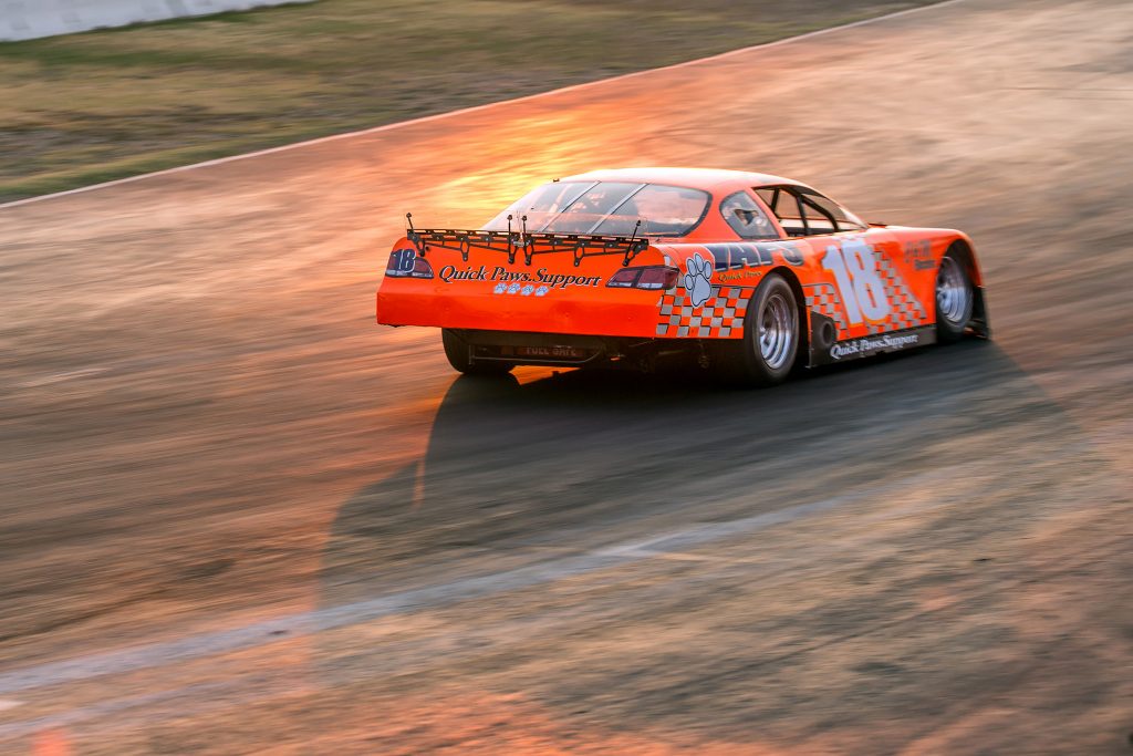Racing into the setting sun down the back straight at Madera Speedway.